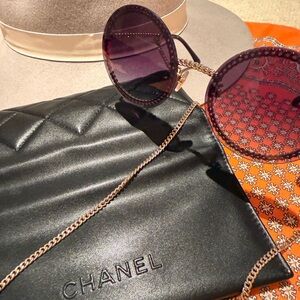 CHANEL Round Purple Sunglasses with Chain Accent